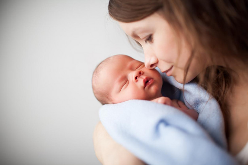 newborn-baby-woman-holding.jpg