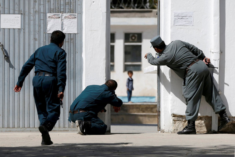 ali-ahmad-reuters-afghan-policemen-try-to-rescue-four-year-old-ali-ahmad.jpg