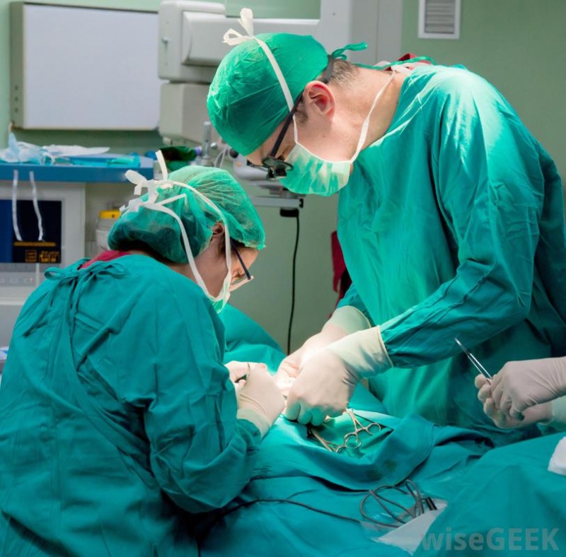 three-scrubbed-people-doing-surgery.jpg