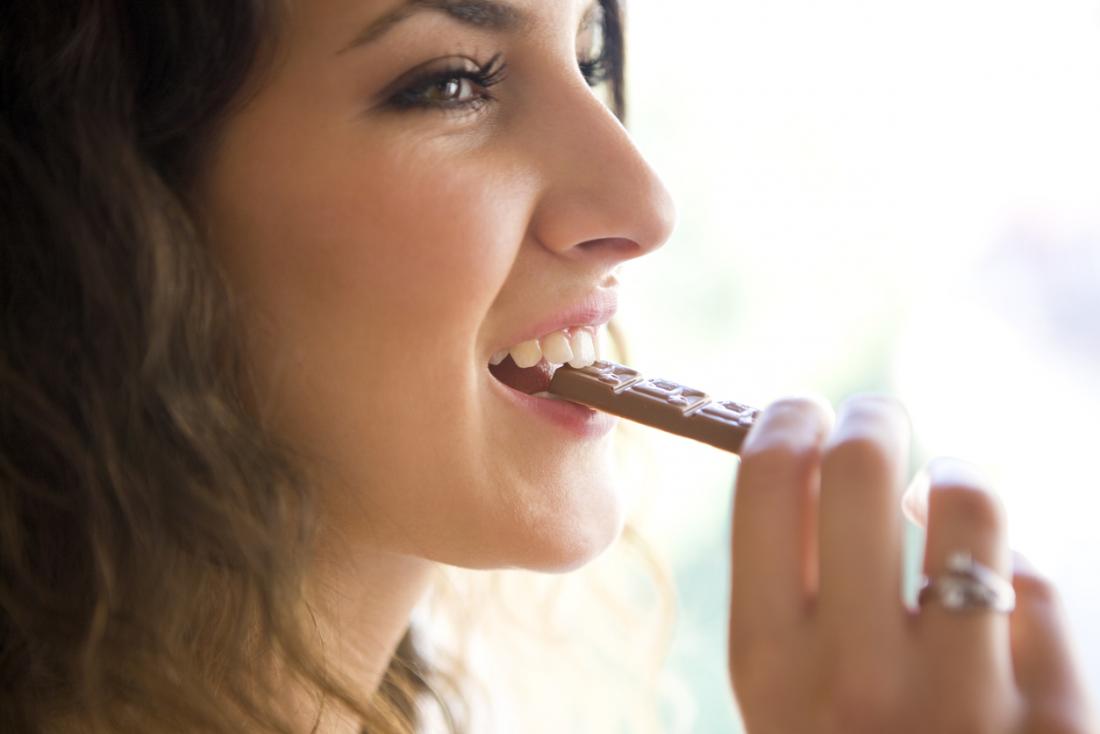 a-woman-eating-some-squares-of-chocolate.jpg