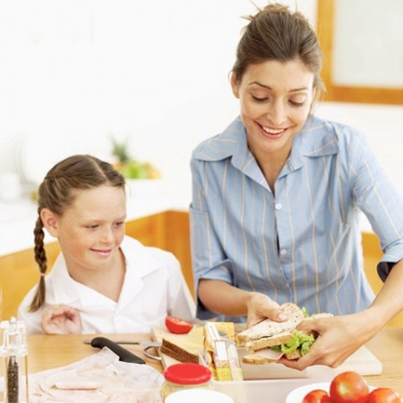 mom-and-daughter-making-turkey-sandwich.jpg