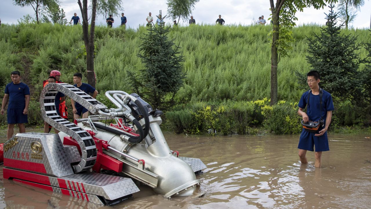 Lũ lụt kỷ lục trong 140 năm nhấm chìm vựa lúa của Trung Quốc - Ảnh 2.