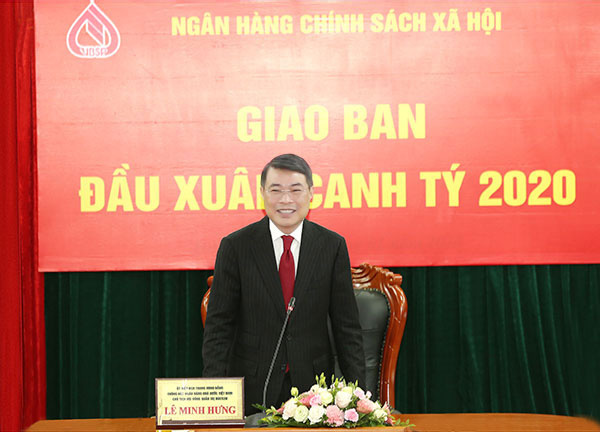 Thống đốc NHNN Lê Minh Hưng dự giao ban đầu xuân tại Ngân hàng Chính sách Xã hội - Ảnh 1.