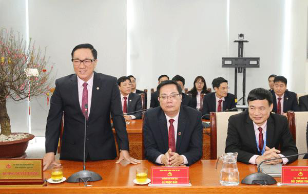 Thống đốc NHNN Lê Minh Hưng dự giao ban đầu xuân tại Ngân hàng Chính sách Xã hội - Ảnh 2.