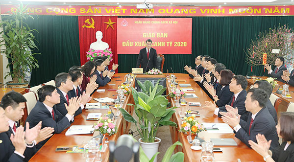 Thống đốc NHNN Lê Minh Hưng dự giao ban đầu xuân tại Ngân hàng Chính sách Xã hội - Ảnh 3.