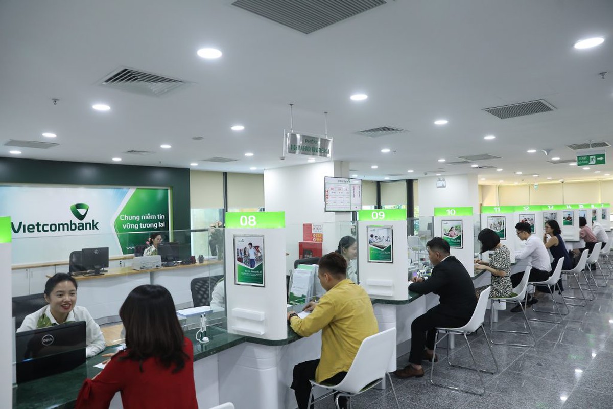 Tín dụng chạy nhanh hơn huy động, ngân hàng chịu sức ép kép - Ảnh 1.
