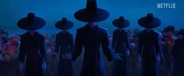 Các thành viên của Saja Boys, một nhóm nhạc nam K-pop hư cấu, xuất hiện trong trang phục lấy cảm hứng từ jeoseung saja, phiên bản thần chết của Hàn Quốc, trong một cảnh phim từ series “KPop Demon Hunters” của Netflix. Ảnh được lấy từ kênh YouTube của Netflix.