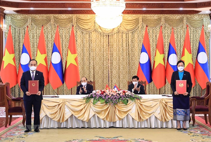 Việt Nam và Lào ký kết 14 văn kiện hợp tác - Ảnh 2.