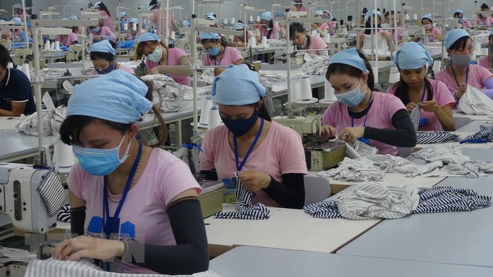 Bình đẳng giới giúp ngành dệt may, da giầy Việt Nam phục hồi sau Covid-19 - Ảnh 1.