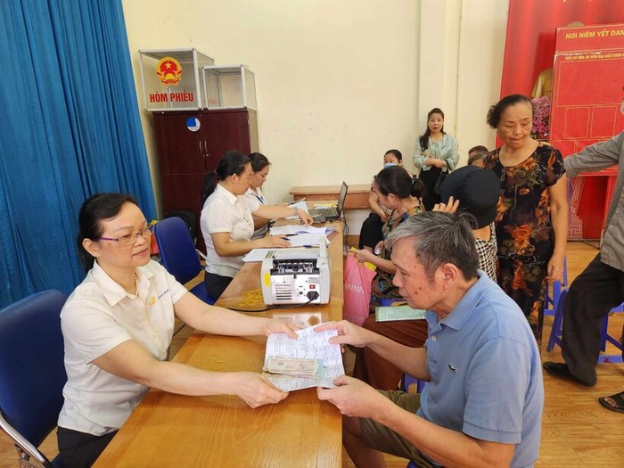 Hà Nội đề xuất chi gần 19 tỷ đồng hỗ trợ phí giao dịch khi chi trả an sinh xã hội- Ảnh 1.