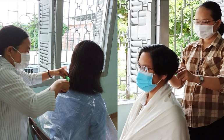 Các nữ tu cắt tóc trước khi lên đường vào tuyến đầu chống dịch Covid-19. Ảnh: TGPSG