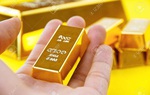Giá vàng giảm mạnh trước áp lực đồng USD tăng giá