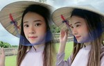 Midu mặc áo dài tím, đội nón lá đẹp như nàng thơ xứ Huế