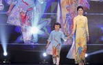 Hoa khôi Miss Photo Vũ Hương Giang diện áo dài phản đối nạn bạo hành, xâm hại