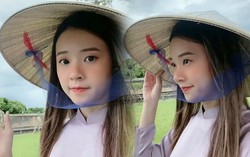 Midu mặc áo dài tím, đội nón lá đẹp như nàng thơ xứ Huế