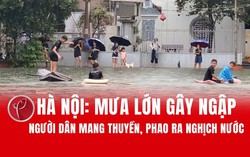 Hà Nội: Mưa lớn gây ngập, người dân mang thuyền, phao ra "nghịch" nước