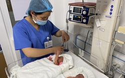 Cặp song sinh đầu tiên được chữa bệnh từ trong bào thai chào đời khỏe mạnh