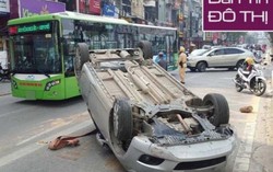 Mẹ lái ô tô chở con bị lật trên làn đường xe buýt nhanh