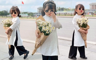 Bé gái diện áo dài trắng, chụp ảnh khắp phố phường Hà Nội