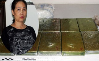 Người phụ nữ xách 12 bánh heroin khai được trả công 100 triệu đồng